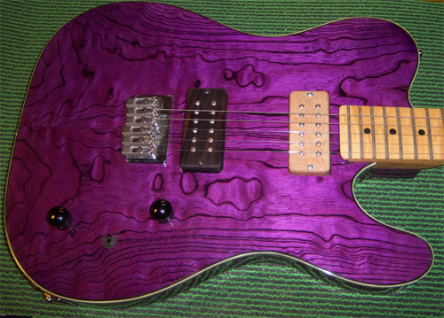 purple telecaster with wooden pickup covers